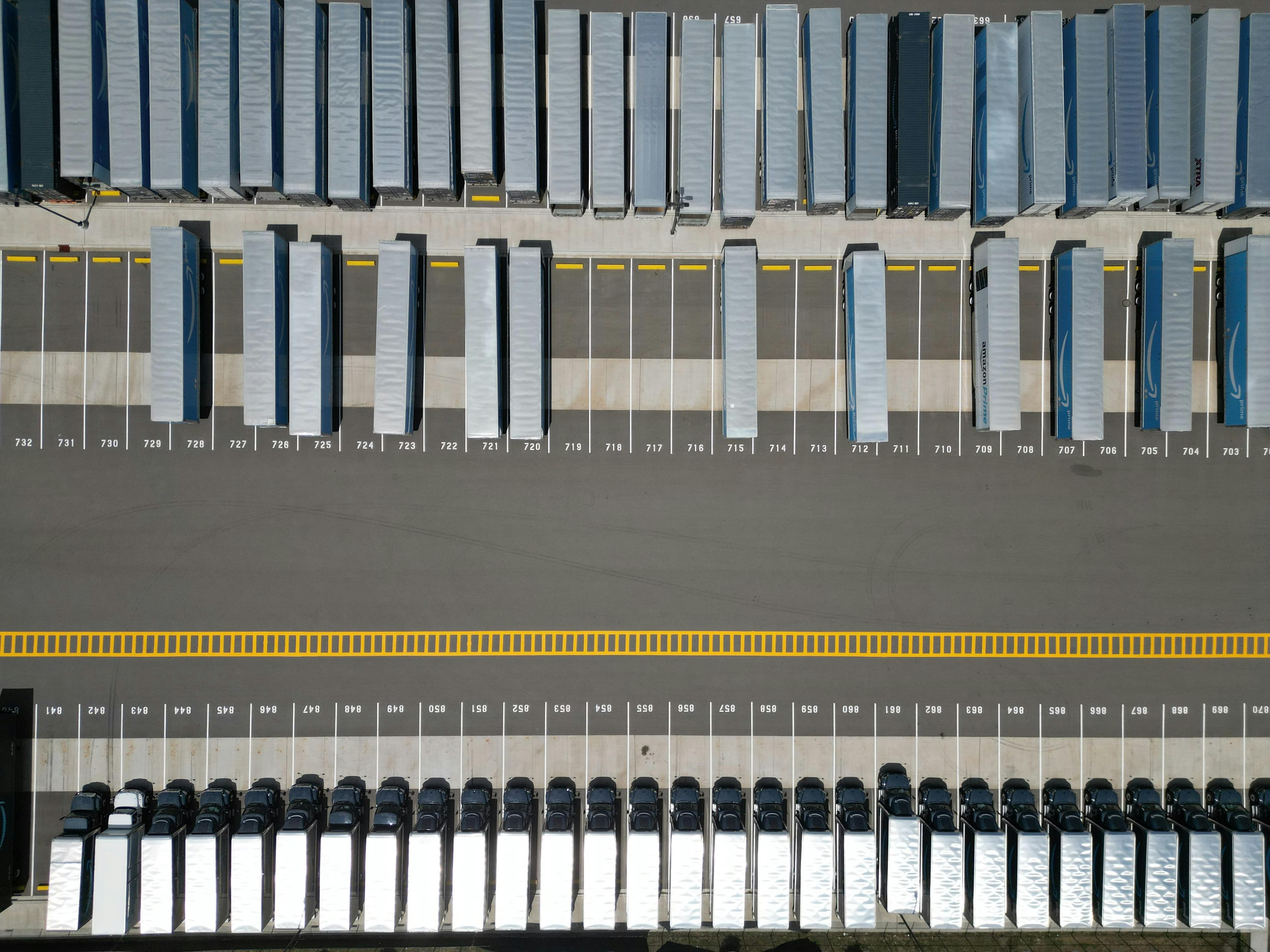 An aerial view of trailers and marked loading positions in a freight yard